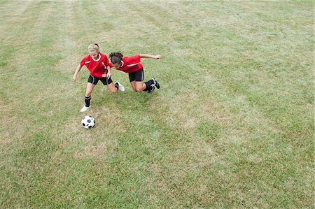 Girls playing soccer Stock Photo - Premium Royalty-Free, Code: 614-03649549