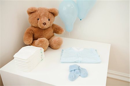 stuffed animal (toy) - Baby clothes and teddy bear Stock Photo - Premium Royalty-Free, Code: 614-03684116