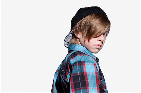 funky looking boy - Teenage boy looking over shoulder Stock Photo - Premium Royalty-Free, Code: 614-03684792