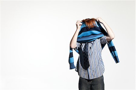 ethnic dressing - Boy taking off his sweater Stock Photo - Premium Royalty-Free, Code: 614-03684830