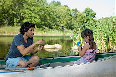 father daughter fishing not woman - Father and daughter on rowboat with fishing rods Stock Photo - Premium Royalty-Free, Code: 614-03697059