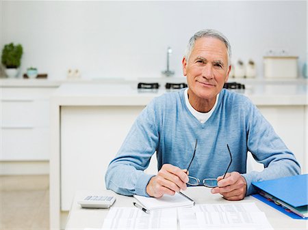 Senior man doing home finances Stock Photo - Premium Royalty-Free, Code: 614-03763777