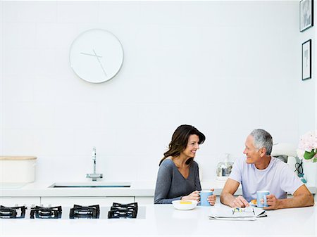 paper on wall - Mature couple having breakfast Stock Photo - Premium Royalty-Free, Code: 614-03763809