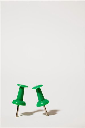 pins - Two green thumbtacks Stock Photo - Premium Royalty-Free, Code: 614-03763972