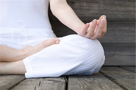 Women in lotus position during yoga Stock Photo - Premium Royalty-Free, Code: 614-03784021