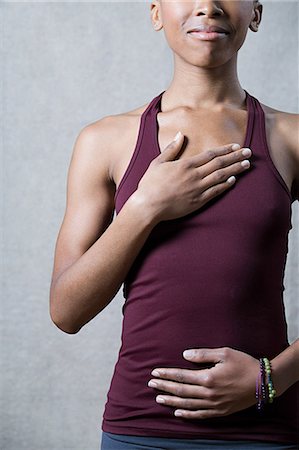 respiring - Women breathing deeply, touching chest and abdomen Stock Photo - Premium Royalty-Free, Code: 614-03784041