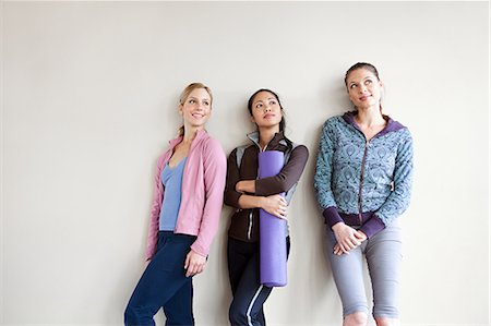 pilates mat - Three women in dance studio standing by wall Stock Photo - Premium Royalty-Free, Code: 614-03783781