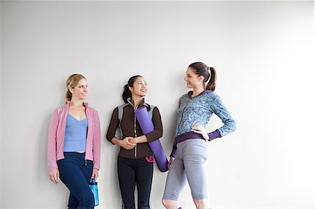 pilates woman - Three women in dance studio standing by wall Stock Photo - Premium Royalty-Free, Code: 614-03783835