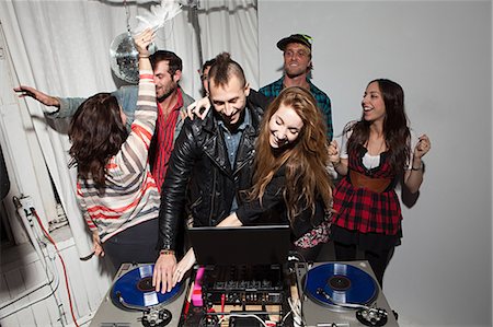 dj turntable - Disc jockeys dancing at party Stock Photo - Premium Royalty-Free, Code: 614-03818508