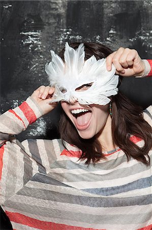 Woman wearing mask at party Stock Photo - Premium Royalty-Free, Code: 614-03818534