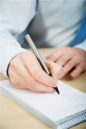 Office worker writing in notebook Foto de stock - Sin royalties Premium, Código: 614-03818863