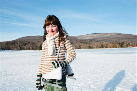 sweater winter - Girl with ice skates, portrait Stock Photo - Premium Royalty-Free, Code: 614-03903011