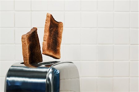 simsearch:614-03903059,k - Two slices of toast popping up from toaster Stock Photo - Premium Royalty-Free, Code: 614-03903075