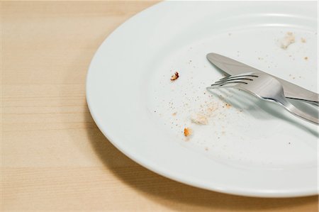 finished - Empty plate with crumbs Stock Photo - Premium Royalty-Free, Code: 614-03903072