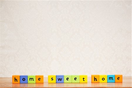 pattern bright - Alphabet blocks spelling home sweet home Stock Photo - Premium Royalty-Free, Code: 614-03903090