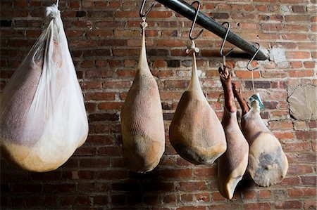 parma ham - Dry cured prosciutto hams Stock Photo - Premium Royalty-Free, Code: 614-03903555