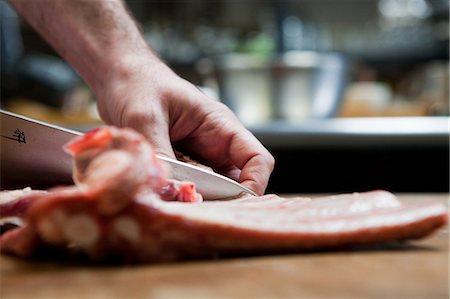 pork meat - Butcher preparing pork ribs Stock Photo - Premium Royalty-Free, Code: 614-03903604