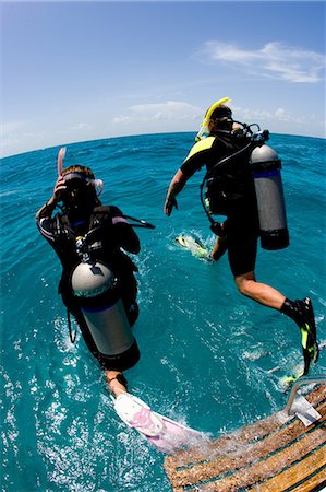 diving men - Giant stride entry into water Stock Photo - Premium Royalty-Free, Code: 614-03903826