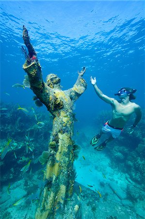 Snorkeler and underwater statue Stock Photo - Premium Royalty-Free, Code: 614-03903823