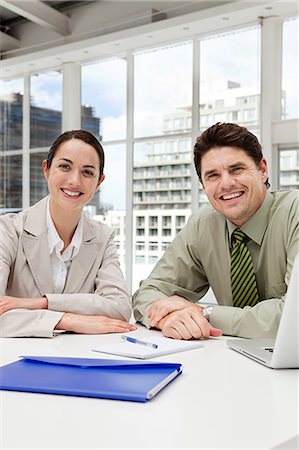 simsearch:614-03981680,k - Businessman and businesswoman meeting in office Stock Photo - Premium Royalty-Free, Code: 614-03981659