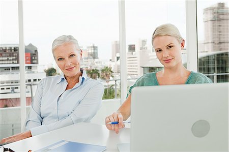 simsearch:614-03981680,k - Two businesswomen using laptop in office Stock Photo - Premium Royalty-Free, Code: 614-03981664