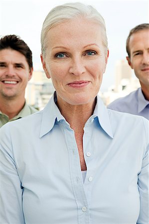 simsearch:614-03981680,k - Three businesspeople, focus on woman Stock Photo - Premium Royalty-Free, Code: 614-03981665