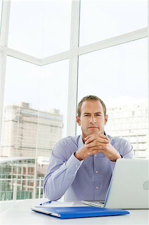 portrait 40 year old man serious straight on - Businessman in office Stock Photo - Premium Royalty-Free, Code: 614-03981688