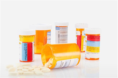 prescription - Pill containers and pills spilling Stock Photo - Premium Royalty-Free, Code: 614-03982134