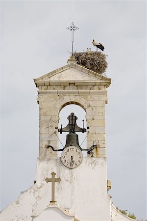 Portugal, Algarve, Faro, belfry and stork nest Stock Photo - Premium Royalty-Free, Code: 610-01577112