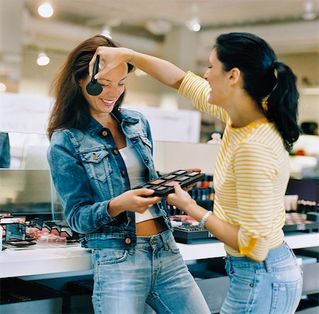 department store - Two women in a make-up store. Stock Photo - Premium Royalty-Free, Code: 6102-03748173