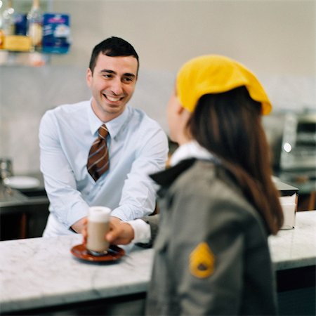 people coffee bar - A woman talking to a man in a cafe. Stock Photo - Premium Royalty-Free, Code: 6102-03748177