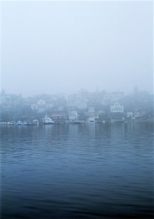 simsearch:6102-06336573,k - A community by the water concealed in fog. Stock Photo - Premium Royalty-Free, Code: 6102-03749080