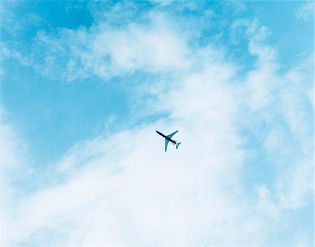 plane sky cloud looking up not people - An airplane on a cloudy sky. Stock Photo - Premium Royalty-Free, Code: 6102-03749095