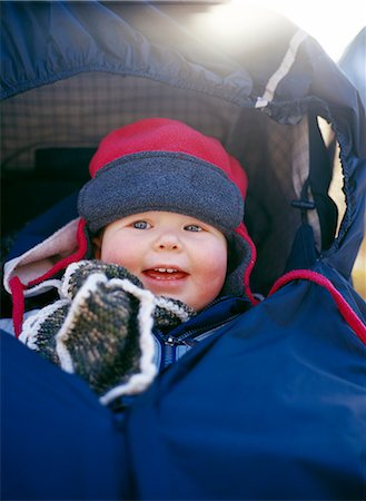 stroller - A baby girl dressed in winter clothes. Stock Photo - Premium Royalty-Free, Code: 6102-03749308