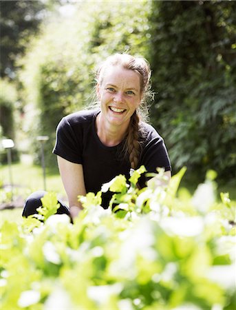 simsearch:6102-03750096,k - Woman working in a garden. Stock Photo - Premium Royalty-Free, Code: 6102-03749766