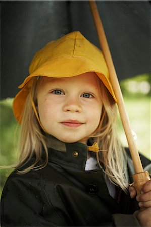 Girl wearing rain clothes. Stock Photo - Premium Royalty-Free, Code: 6102-03749702