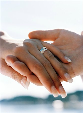 A bridal couple holding hands. Stock Photo - Premium Royalty-Free, Code: 6102-03749721