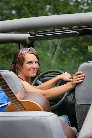 Woman sitting in a convertible. Stock Photo - Premium Royalty-Free, Code: 6102-03749820