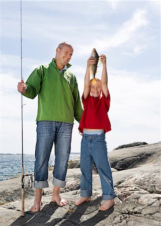 simsearch:6102-03867416,k - Father and son with caught fish. Stock Photo - Premium Royalty-Free, Code: 6102-03749966