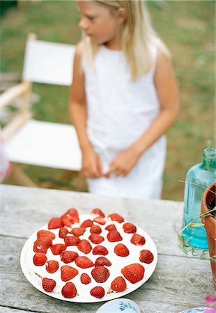 fruit birthday cake photo - A strawberry cake on a table. Stock Photo - Premium Royalty-Free, Code: 6102-03750008