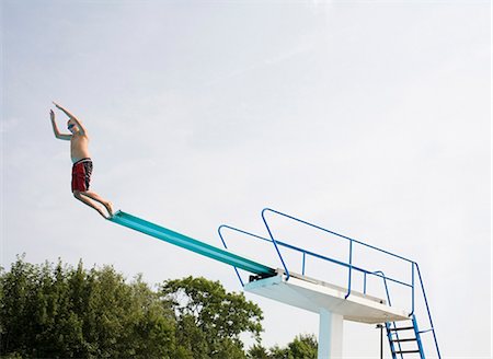 A boy on a diving-board. Stock Photo - Premium Royalty-Free, Code: 6102-03750126