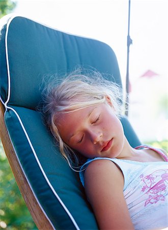 sleeping backyard - A girl sleeping in a hammock. Stock Photo - Premium Royalty-Free, Code: 6102-03750216