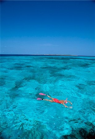 A woman snorkeling. Stock Photo - Premium Royalty-Free, Code: 6102-03750464