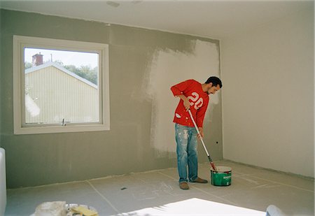 simsearch:6102-08942583,k - Man painting a wall. Stock Photo - Premium Royalty-Free, Code: 6102-03750426