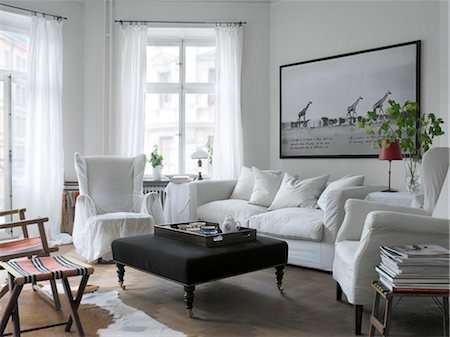 simsearch:6102-03827987,k - A white couch in a living room. Stock Photo - Premium Royalty-Free, Code: 6102-03750674