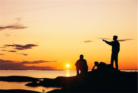 sunset point - Silhouette of people in the archipelago. Foto de stock - Sin royalties Premium, Código: 6102-03750691