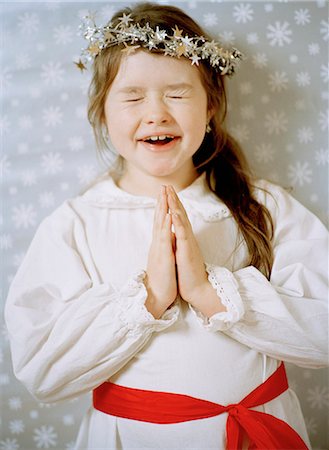 A girl celebrating Lucia in Sweden. Stock Photo - Premium Royalty-Free, Code: 6102-03750856