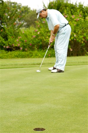 simsearch:6102-03750876,k - A man playing golf. Foto de stock - Sin royalties Premium, Código: 6102-03750985