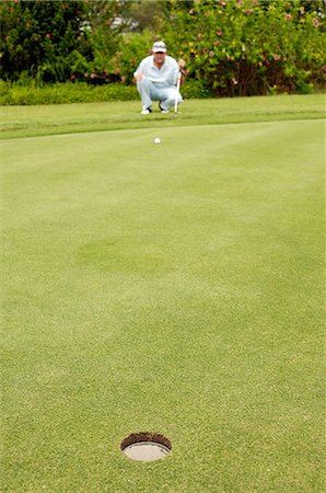 simsearch:6102-03750876,k - A man playing golf. Foto de stock - Sin royalties Premium, Código: 6102-03750986