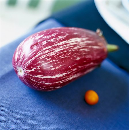 simsearch:6102-03749129,k - Close-up of raw aubergine on blue table Stock Photo - Premium Royalty-Free, Code: 6102-03858876